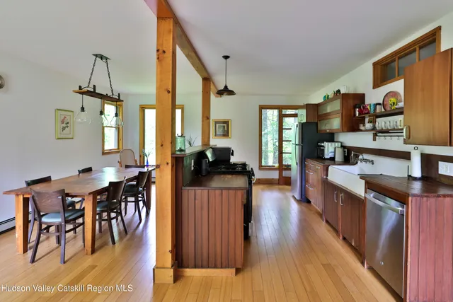 a large kitchen with lots of counter space and glass table