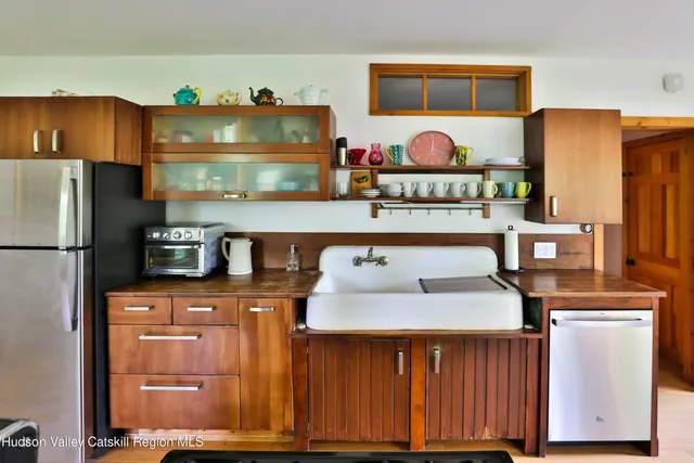 a kitchen with a refrigerator and cabinets