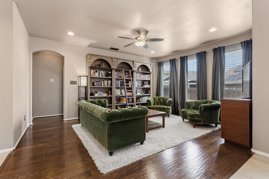 5513 Wharfside Place Denton, TX 76208 - Photo 13 of 37 a living room with furniture and a large window