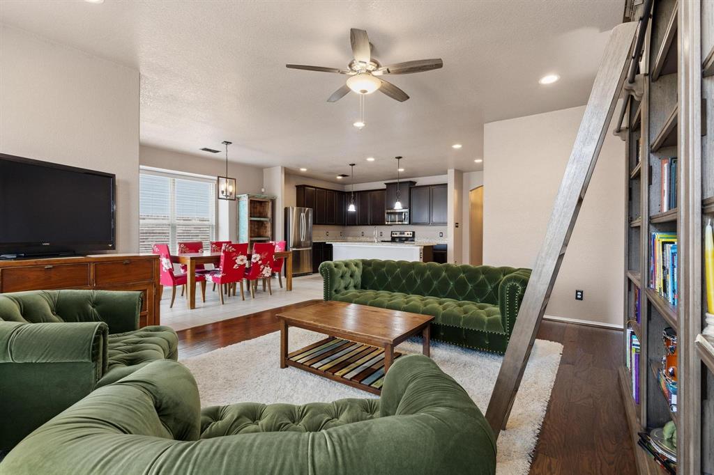 5513 Wharfside Place Denton, TX 76208 - Photo 15 of 37 a living room with furniture and a flat screen tv