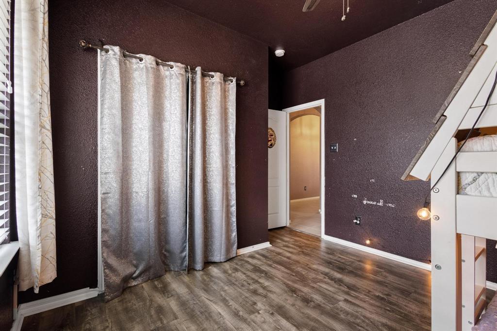 5513 Wharfside Place Denton, TX 76208 - Photo 20 of 37 a view of a hallway with wooden floor and staircase