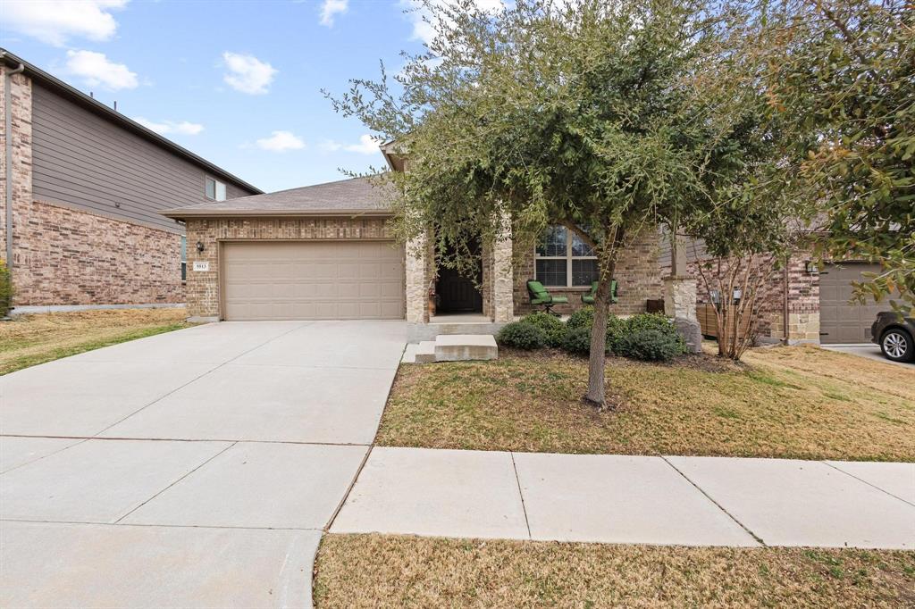 5513 Wharfside Place Denton, TX 76208 - Photo 2 of 37 a view of a house with a tree