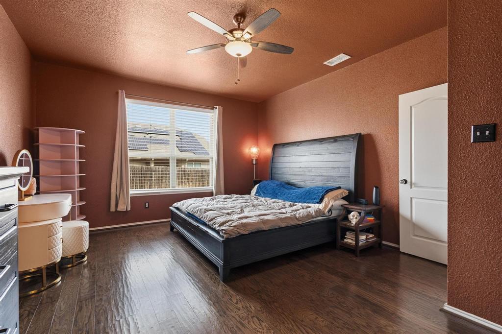 5513 Wharfside Place Denton, TX 76208 - Photo 26 of 37 a bedroom with a bed and a window