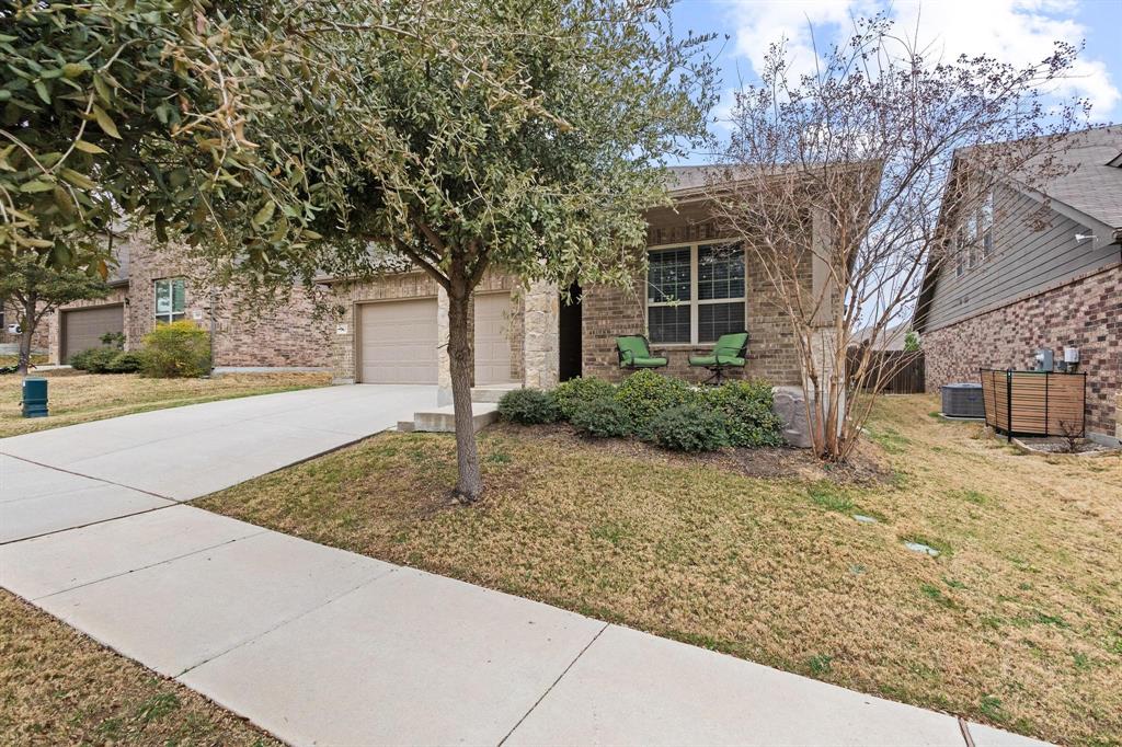 5513 Wharfside Place Denton, TX 76208 - Photo 3 of 37 a front view of a house with trees