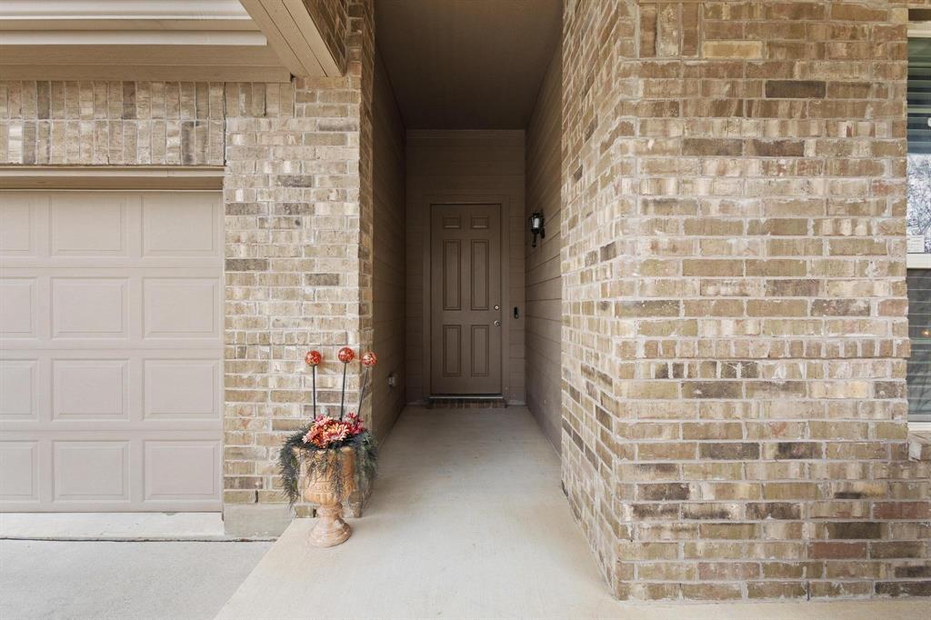 5513 Wharfside Place Denton, TX 76208 - Photo 5 of 37 a view of an empty room and wooden floor