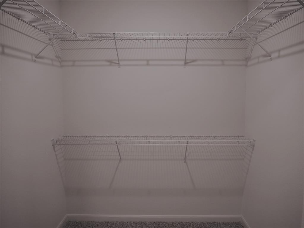 13612 Musselshell Drive Ponder, TX 76259 - Photo 18 of 39 a view of a room with racks on the wall