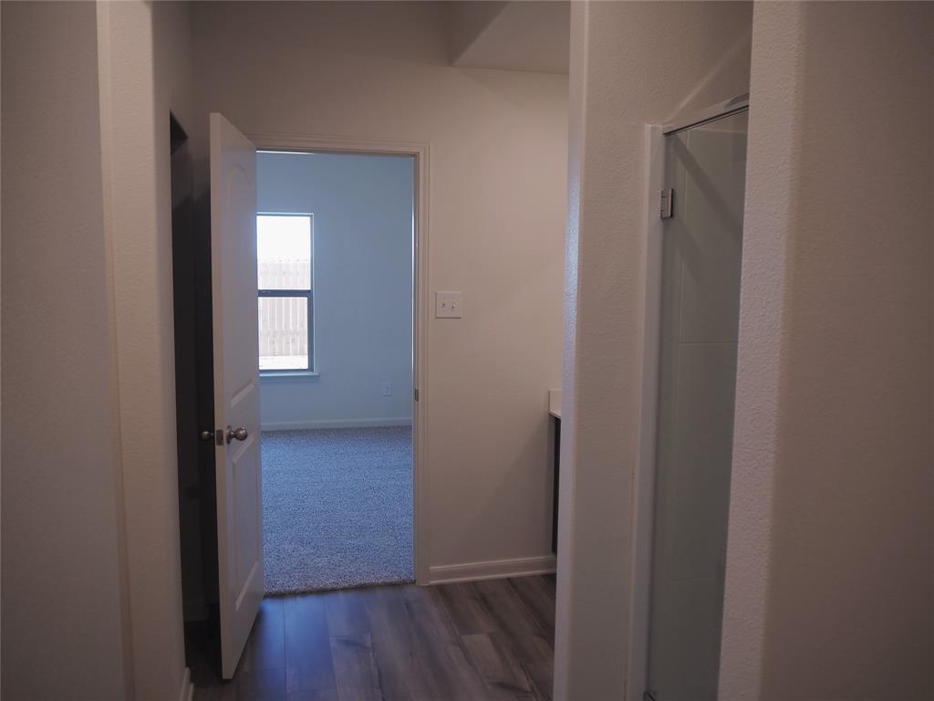 13612 Musselshell Drive Ponder, TX 76259 - Photo 19 of 39 a view of hallway with wooden floor