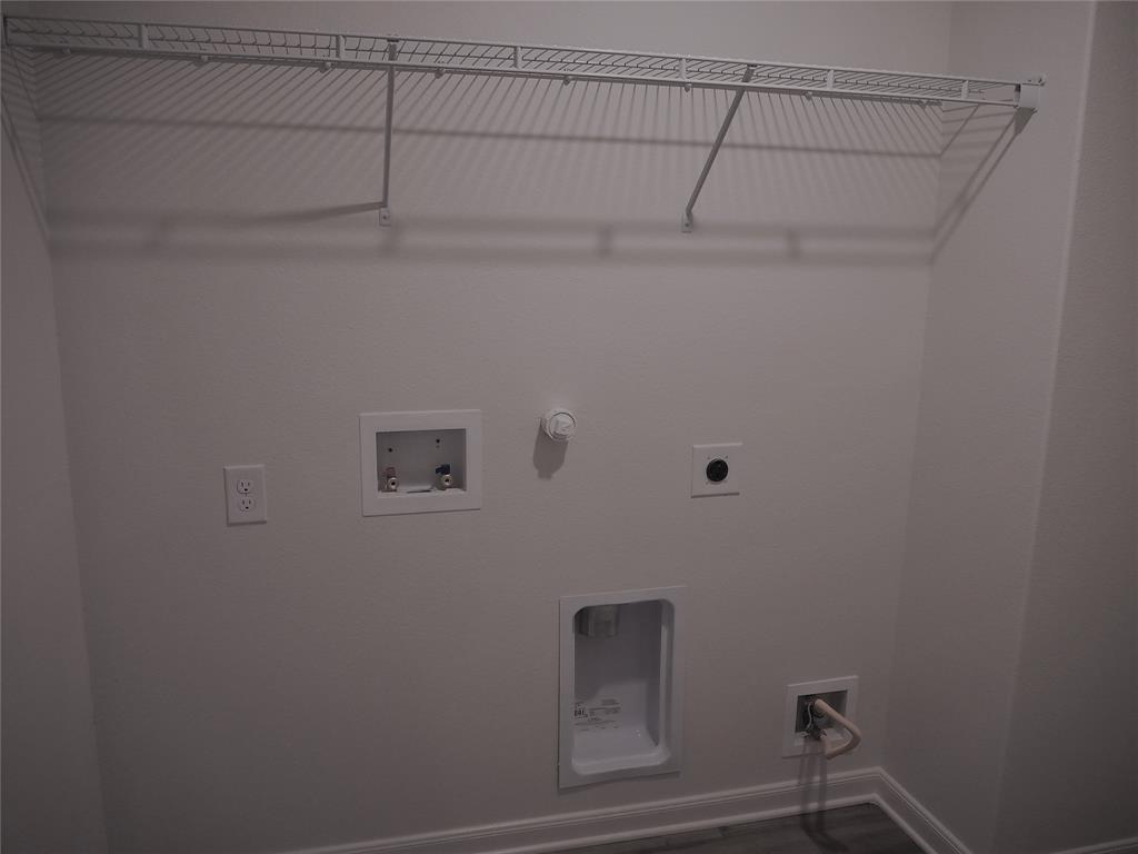 13612 Musselshell Drive Ponder, TX 76259 - Photo 27 of 39 a view of a room with racks on the wall