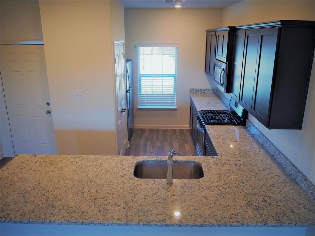 13612 Musselshell Drive Ponder, TX 76259 - Photo 5 of 39 view of kitchen with wooden floor