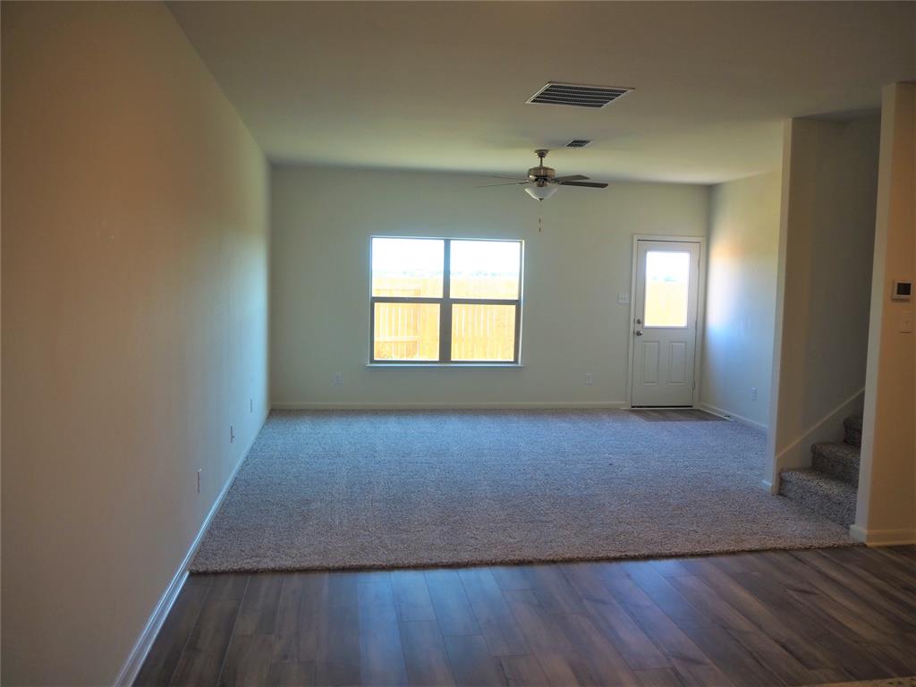 13612 Musselshell Drive Ponder, TX 76259 - Photo 10 of 39 wooden floor in an empty room with a window