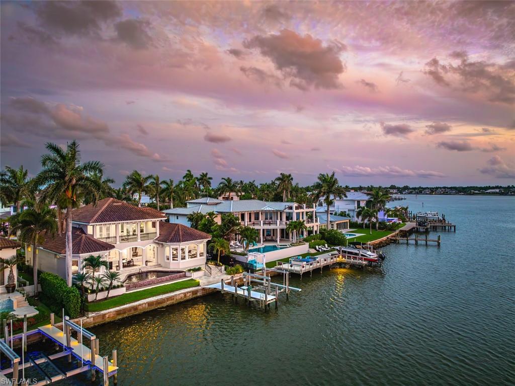 1942 Kingfish Road Naples, FL 34102 - Photo 41 of 43 a view of a lake with houses