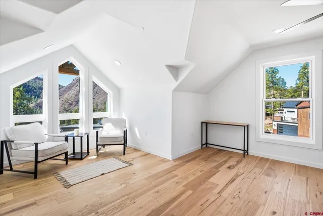 a view of a livingroom with furniture and wooden floor
