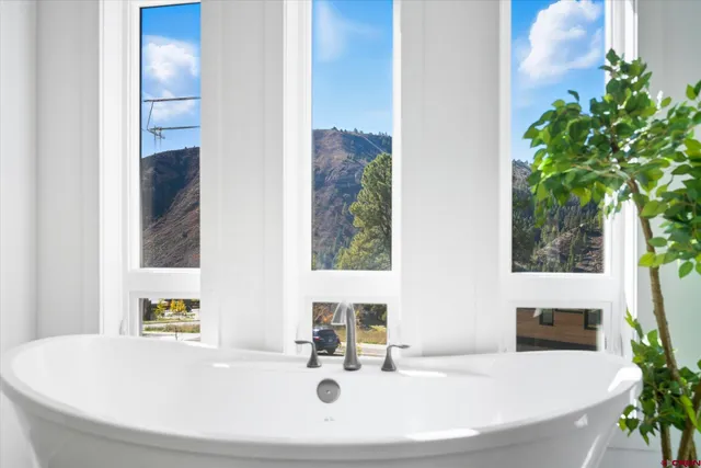 a bathroom with a bathtub and a sink