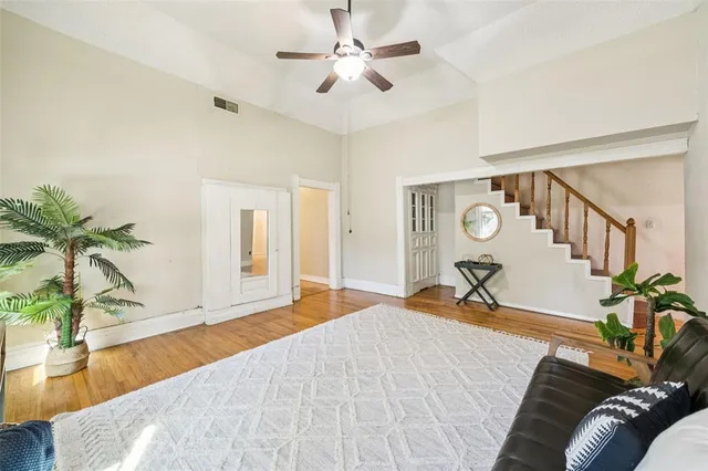 a bedroom with a bed and a potted plant