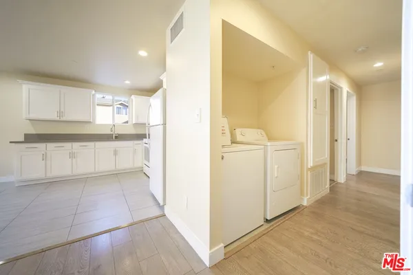 a view of a kitchen with a sink