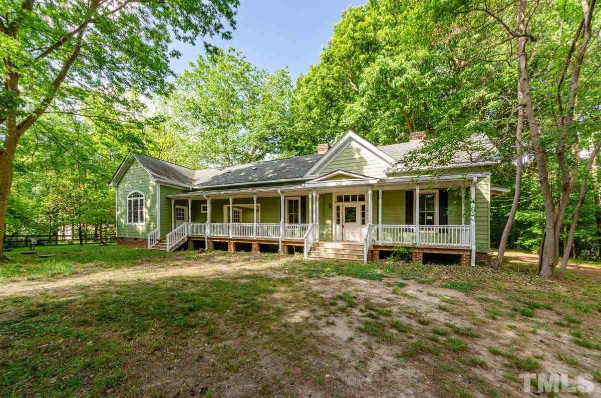 5816 Old Stage Road Raleigh, NC 27603 - Photo 1 of 30 a front view of a house with a garden