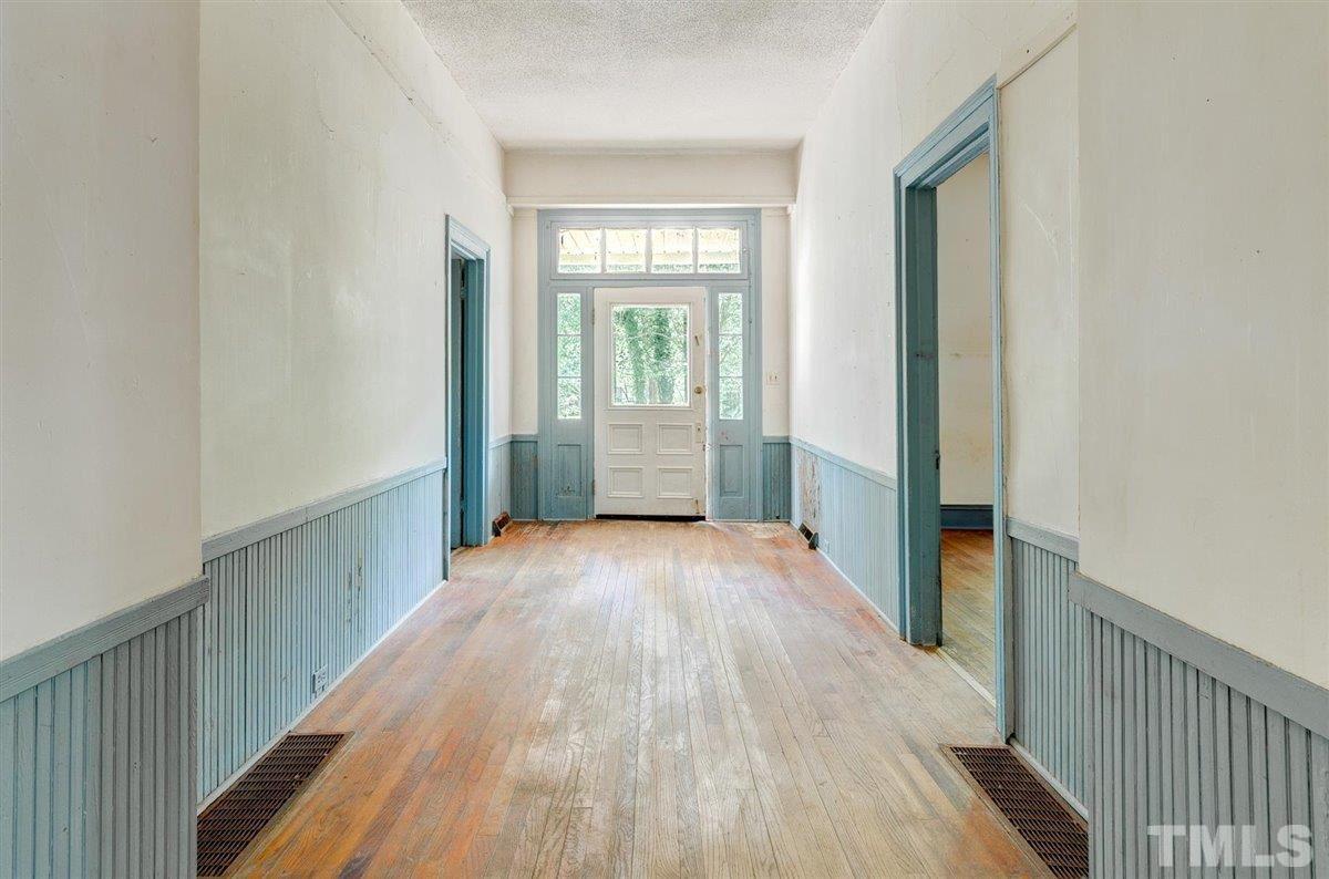 5816 Old Stage Road Raleigh, NC 27603 - Photo 17 of 30 a view of a hallway with wooden floor