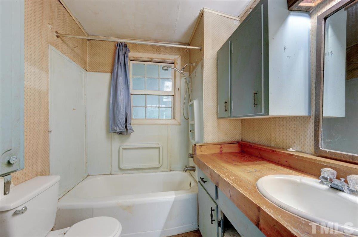 5816 Old Stage Road Raleigh, NC 27603 - Photo 20 of 30 a bathroom with a sink toilet and shower