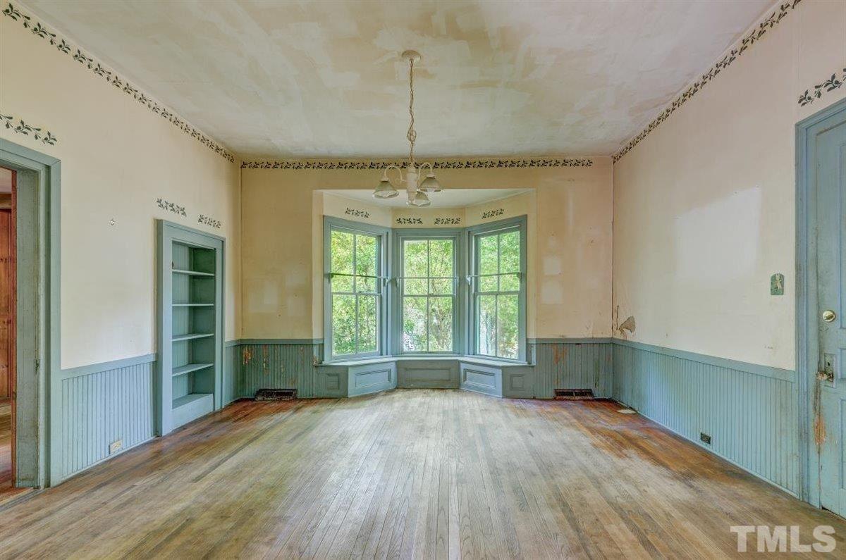 5816 Old Stage Road Raleigh, NC 27603 - Photo 22 of 30 a view of empty room with wooden floor and fan