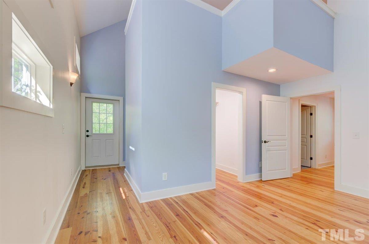5816 Old Stage Road Raleigh, NC 27603 - Photo 7 of 30 a view of livingroom with wooden floor and staircase
