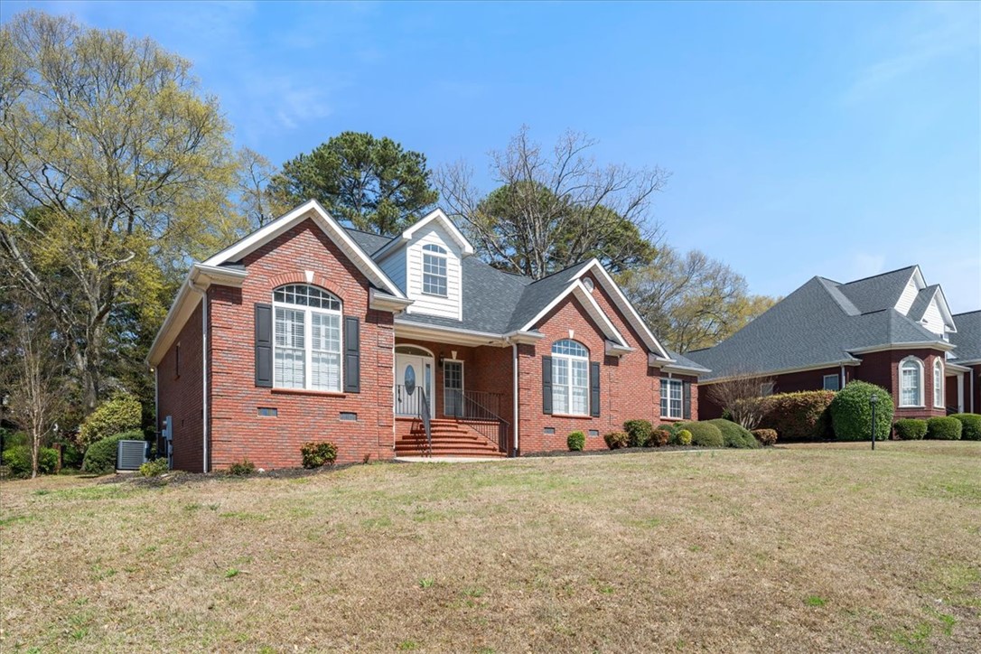 128 Cayman Way Anderson, SC 29621 - Photo 2 of 49 This classic brick residence features dormer windows and inviting entryway, offering timeless curb appeal.