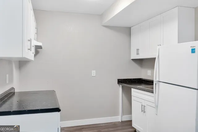 a room with cabinets and a wooden floor