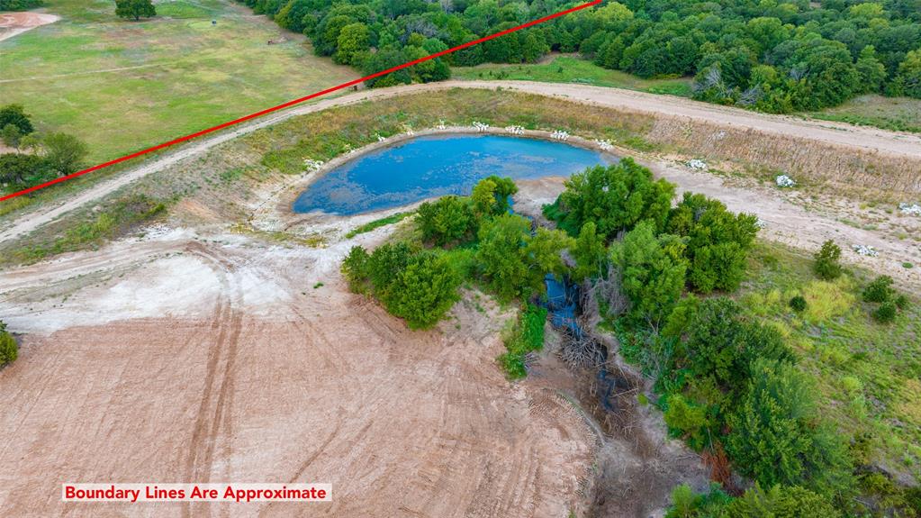 1690 Jim Ned Road Montague, TX 76251 - Photo 6 of 15 a view of a garden with a bench in yard