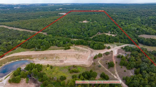 a view of a field with an ocean view