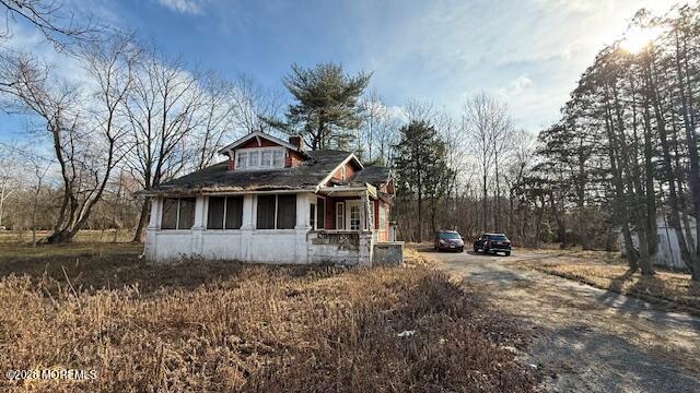 465 Lakewood Farmingdale Road Howell, NJ 07731 - Photo 12 of 19 a front view of a house with a yard