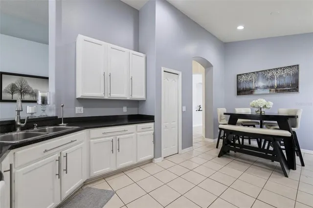 a kitchen with white cabinets