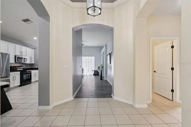 a living room with a bed furniture and a window