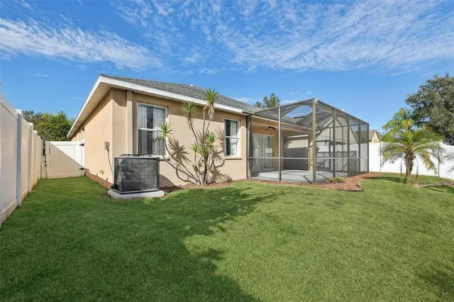 a view of a backyard with large trees