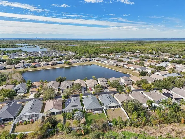 a view of a house with a yard and a garden
