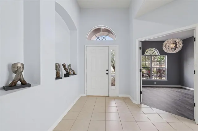 a view of an entryway with wooden floor