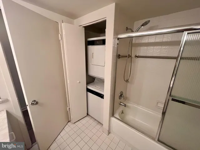 a bathroom with a glass door shower
