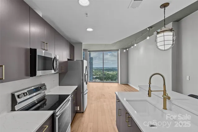 a kitchen with a stove and a refrigerator