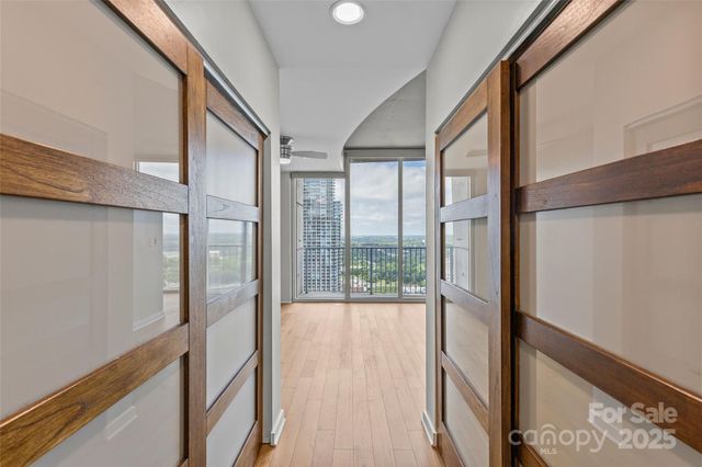 a bathroom with a granite countertop sink a toilet and a mirror