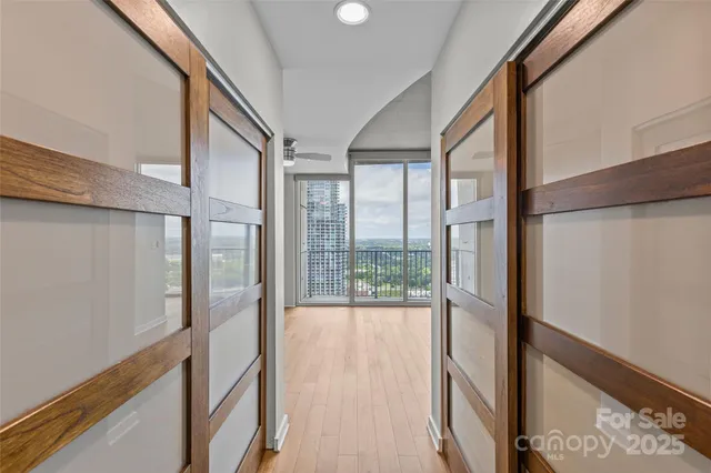 a bathroom with a granite countertop sink a toilet and a mirror
