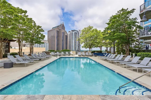 a outdoor living space with patio furniture and a fireplace