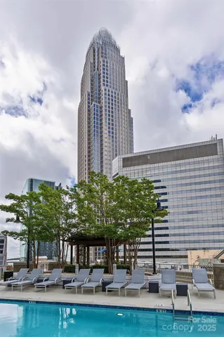 a view of a patio with a table and chairs under an umbrella