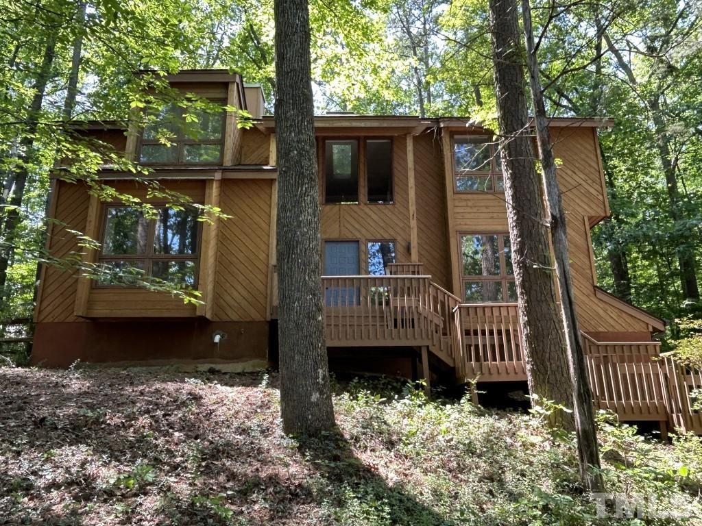 408 Constitution Drive Durham, NC 27705 - Photo 1 of 39 a view of a house with a yard and deck