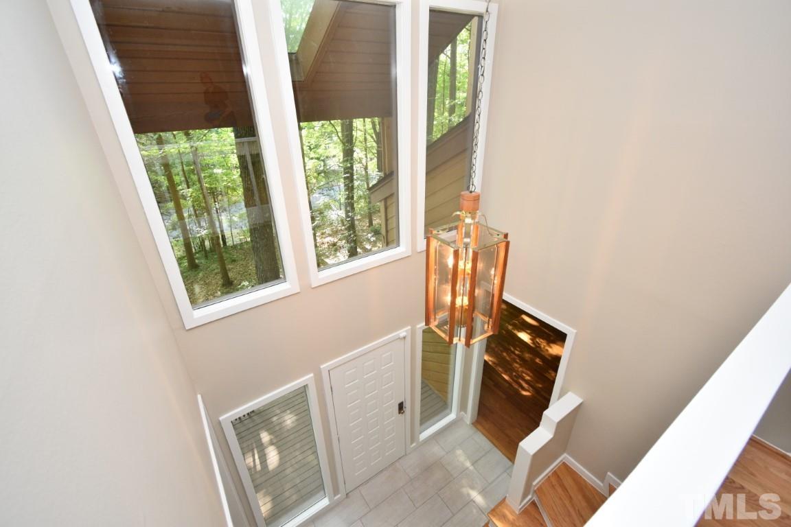 408 Constitution Drive Durham, NC 27705 - Photo 12 of 39 a view of an entryway with wooden floor