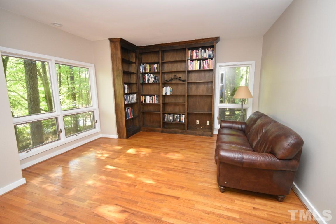 408 Constitution Drive Durham, NC 27705 - Photo 15 of 39 a living room with furniture and a large window
