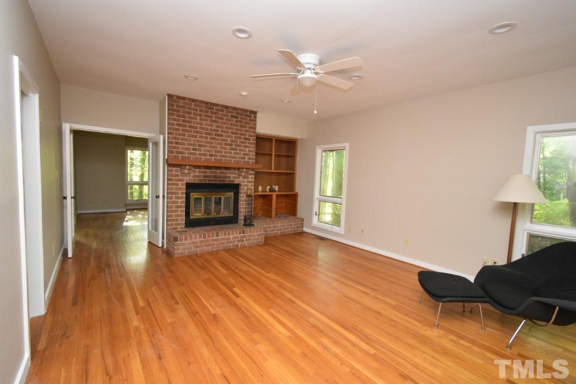 408 Constitution Drive Durham, NC 27705 - Photo 17 of 39 a living room with furniture and a fireplace