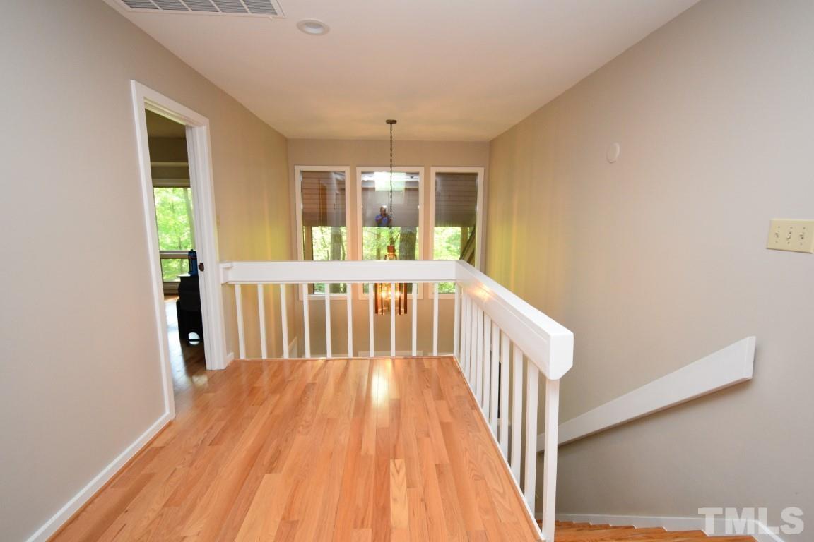 408 Constitution Drive Durham, NC 27705 - Photo 25 of 39 a view of porch with wooden floor