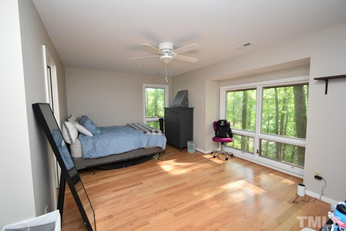 408 Constitution Drive Durham, NC 27705 - Photo 26 of 39 a bedroom with furniture and a large window