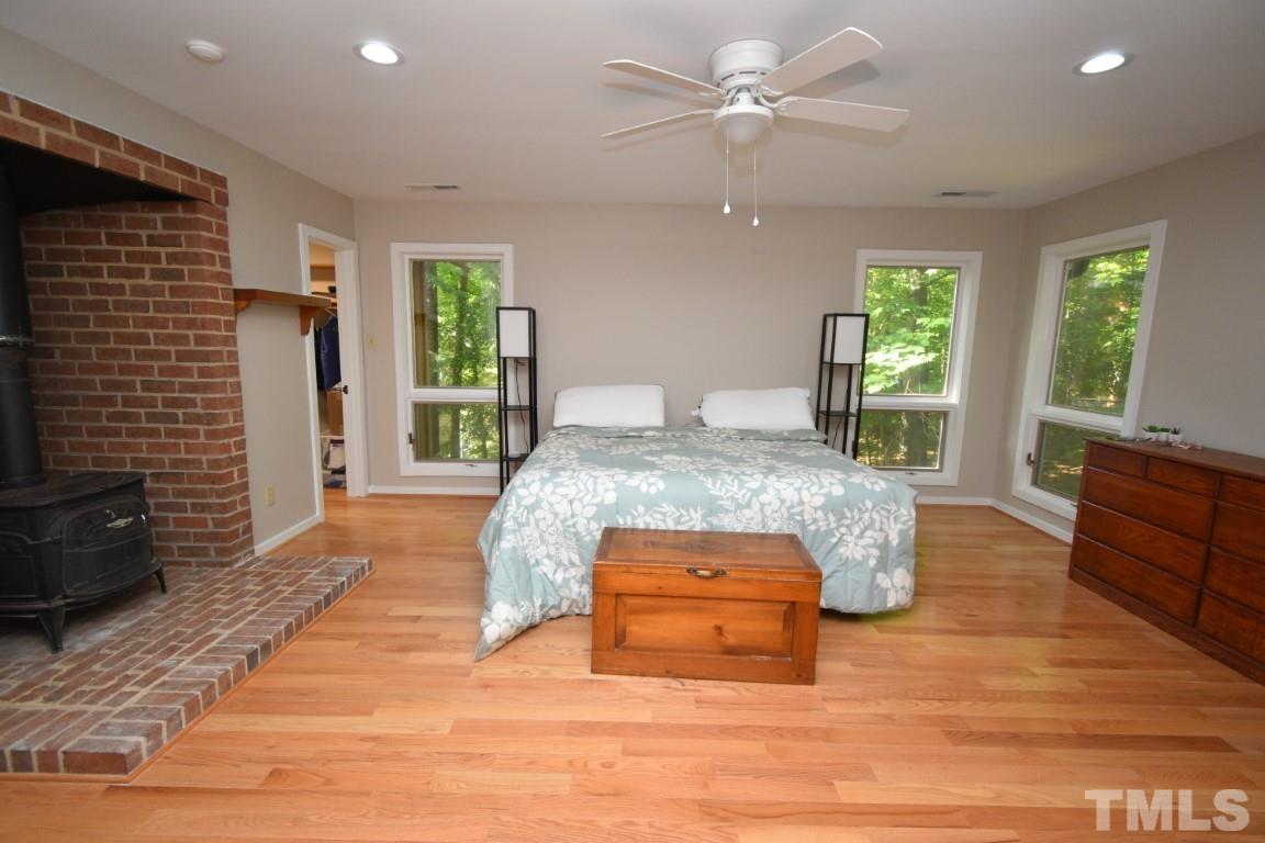 408 Constitution Drive Durham, NC 27705 - Photo 28 of 39 a living room with furniture and a fireplace