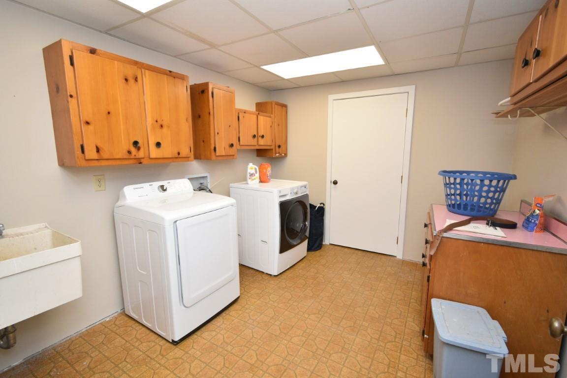 408 Constitution Drive Durham, NC 27705 - Photo 33 of 39 a utility room with dryer and washer