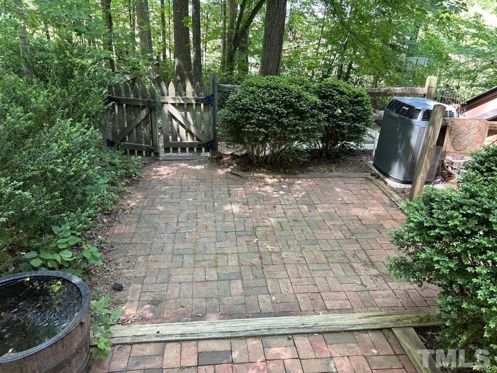 408 Constitution Drive Durham, NC 27705 - Photo 38 of 39 a view of backyard with plants and trees