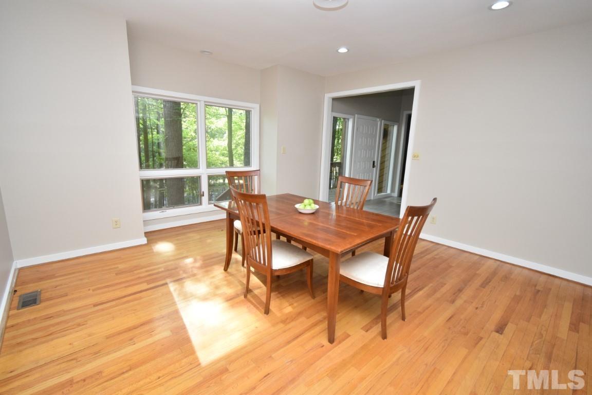 408 Constitution Drive Durham, NC 27705 - Photo 10 of 39 a workspace with wooden floor